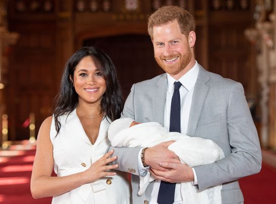 Britain\'s Prince Harry, Duke of Sussex (R), and his wife Meghan, Duchess of Sussex, pose for a photo with their newborn baby son in St George\'s Hall at Windsor Castle in Windsor, west of London on May 8, 2019. 