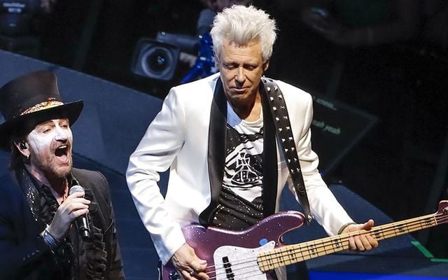 U2\'s Bono and Adam Clayton on stage in Chicago, in 2018.