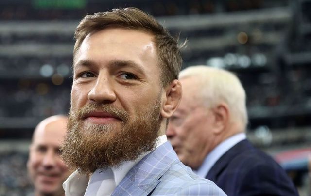 Conor McGregor is seen on the sidelines before the NFL game between the Jacksonville Jaguars and Dallas Cowboys at AT&T Stadium on October 14, 2018, in Arlington, Texas. 