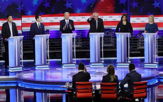 Democratic presidential candidates (L-R) Andrew Yang, Pete Buttigieg, Joe Biden, Bernie Sanders, Kamala Harris, Kirsten Gillibrand take part in the second night of the first Democratic presidential debate on June 27, 2019 in Miami, Florida.