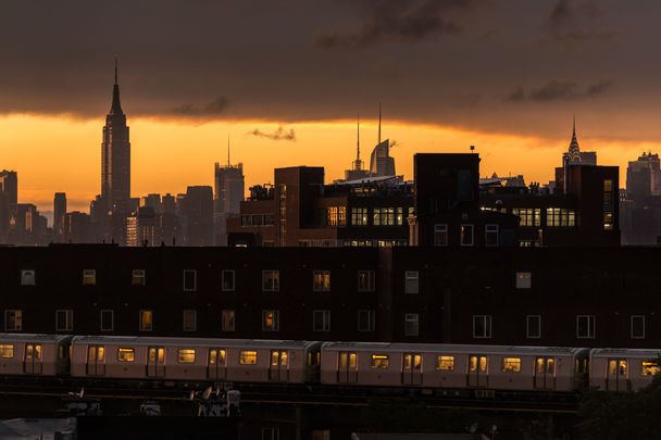 A view of Midtown Manhattan taken from Bushwick, Brooklyn at sunset.
