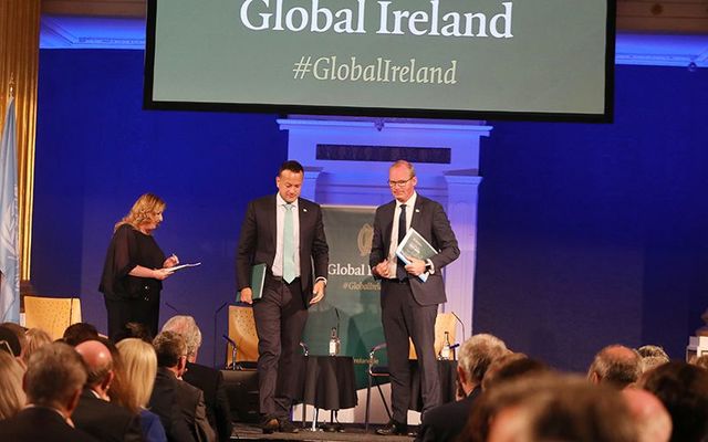 Taoiseach Leo Varadkar and Tanaiste Simon Coveney on stage at the Global Ireland 2025 summit, in Dublin Castle.