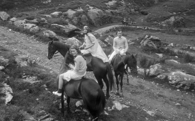 Kathleen Kennedy (left) rides on horseback with an unidentified woman (center) and an unidentified boy through the Gap of Dunloe in Killarney National Park, Killarney, Ireland, during a Kennedy family trip in 1937.