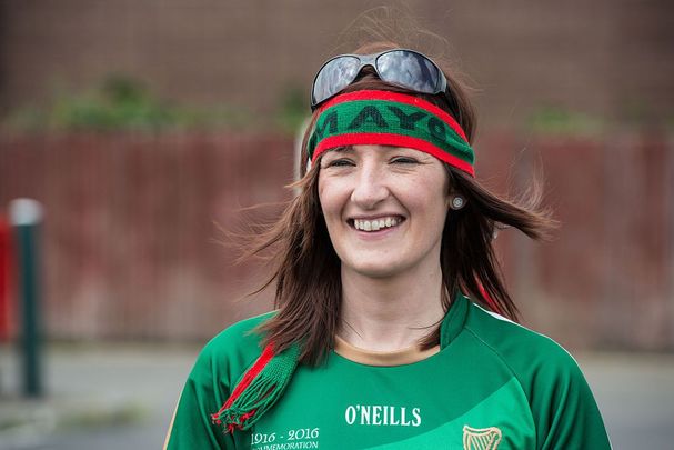 Gaelic football fan Claire Mortimer walks to the pitch as Prime Minister of Ireland Enda Kenny attends an event to meet Irish4Europe campaigners at the London v Mayo Gaelic football game on May 28, 2016, in Ruislip, England. 