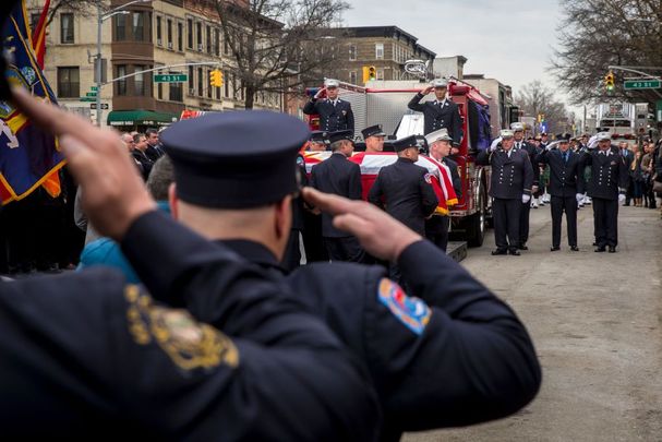 Members of the New York City fire department (FDNY) carry the casket of firefighter Thomas Phelan into St. Michael\'s Church in the Sunset Park neighborhood March 20, 2018, in the Brooklyn borough of New York City. Phelan worked as a Statue of Liberty ferry boat captain, helping to evacuate thousands of stranded citizens from Lower Manhattan during the 9/11 attacks. 