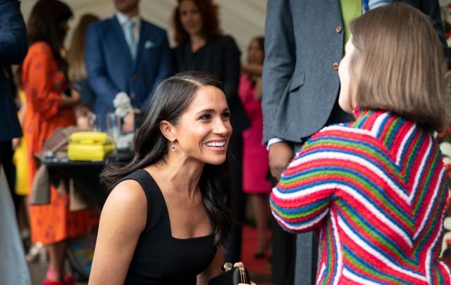 Meghan, Duchess of Sussex chats with Sinead Burke, writer and advocate of fashion and disability rights during a reception at Glencairn, the residence of Robin Barnett, the British Ambassador to Ireland during day one of their visit to Ireland on July 10, 2018, in Dublin, Ireland.
