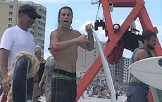 Irish American pro-surfer gets bitten by shark, goes to bar instead of hospital