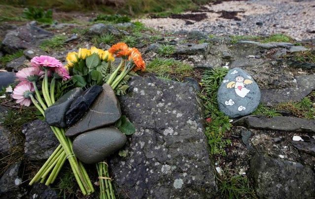 Locals had left flowers on the beach where Baby Belle was discovered in December.