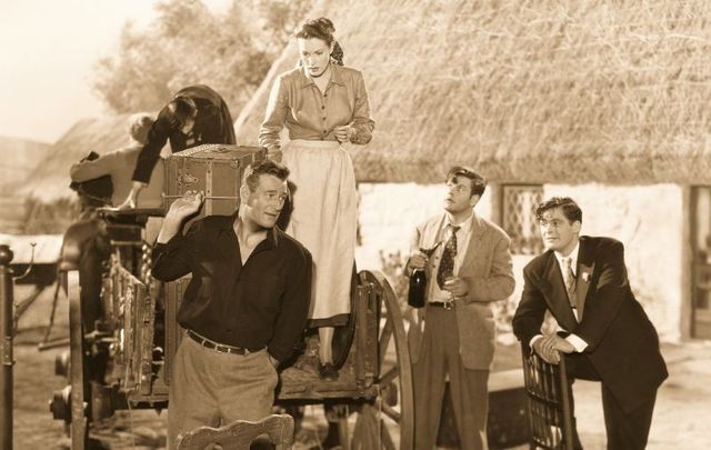 (L to R) John Wayne, Maureen O\'Hara, Sean McClory and Charles Fitzsimons on the set of \"The Quiet Man\" directed by John Ford circa 1952.