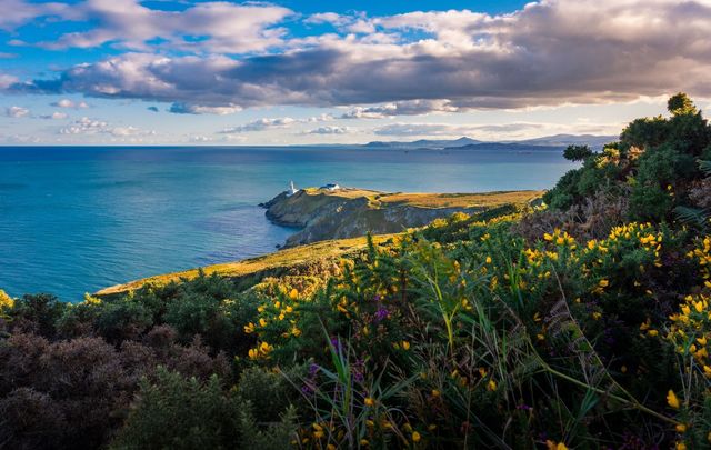 A view of the Bailey Lighthouse, along the running track on Howth Head, Dublin. 