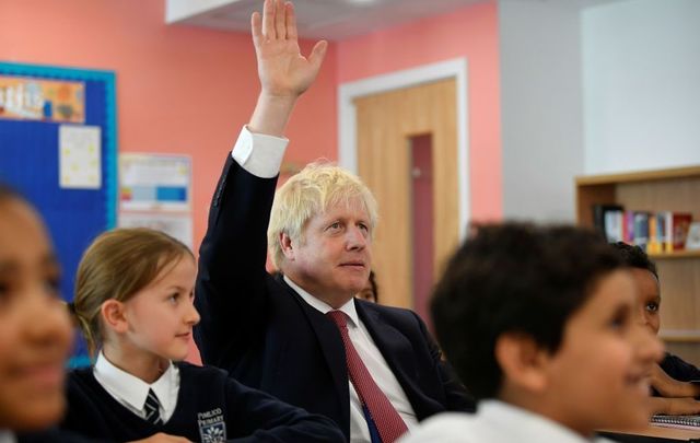 Britain\'s Prime Minister Boris Johnson attends a year six history class with pupils during a visit to Pimlico Primary school on September 10, 2019, in London, England. 