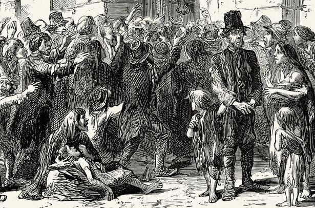 Victims of Ireland\'s famine clamber at the gates of a workhouse.