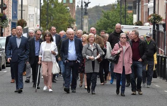 Family members of Bloody Sunday victims walked together to the courthouse in Derry on September 18.