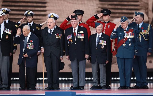 Veterans stand on stage during the D-Day Commemorations on June 5, 2019 in Portsmouth, England