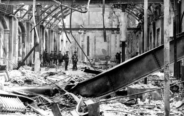 Soldiers survey the interior of the completely wrecked Post Office in Sackville Street, Dublin, during the Easter Rising of 1916.
