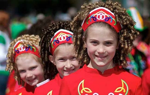 Irish dancers in red dresses.