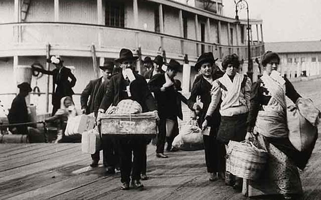 Emigrants landing at Ellis Island, New York: Emigrants have two homes, two places where they have to take us in – and hurray for that.