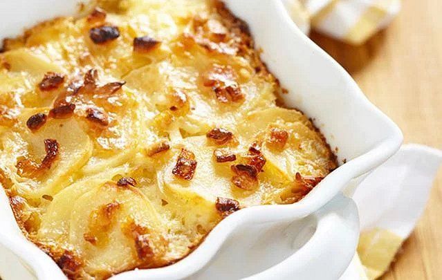 Try these oven-baked creamy wild garlic and cheese potatoes recipe and it\'s sure to be one of your favorites.