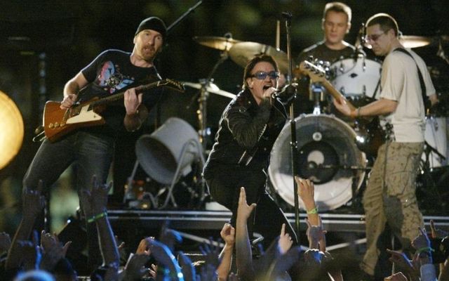 Music group U2 performs during halftime of Super Bowl XXXVI February 3, 2002, at the Superdome in New Orleans. 