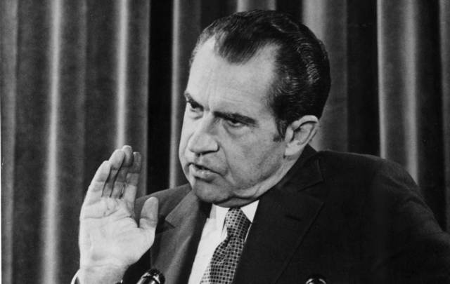 American President Richard Nixon giving a press conference.
