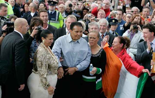 Muhammad Ali arrives at Turnpike Road in Ennis, County Clare,  the location of the birthplace of his great grandfather Abe O\'Grady, with his wife Yolanda (lonnie) right, in 2009.