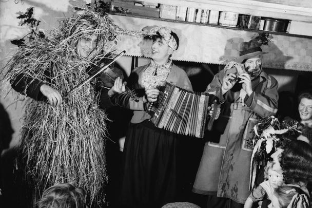 A group of mummers in Ireland celebrate St Stephen\'s Day or \'Wren\'s Day\' on 26th December by processing from house to house with their instruments, circa 1955