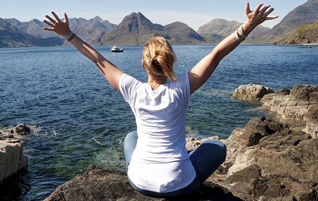 A woman celebrates traveling to Ireland.
