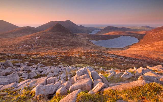 Sunrise over the Mourne Mountains: Strange and wonderful Irish proverbs such as \"For every mile of road there\'s two miles of ditches\"
