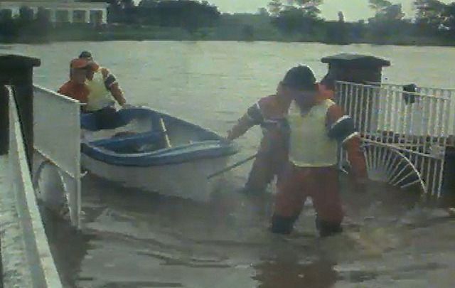 Rescuers battle the flood waters of Hurricane Charley in 1986. 