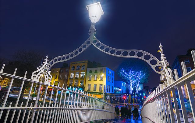 Dublin\'s Ha\'penny Bridge overlooking the Temple Bar area at Christmas time in Dublin. 