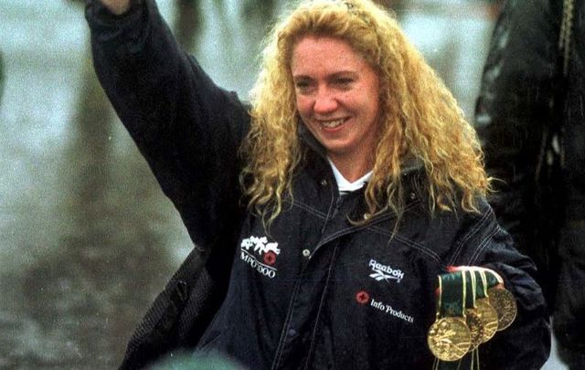 Irish Olympic Swimmer Michelle Smith returns home to Ireland with her four Olympic medals in1996.