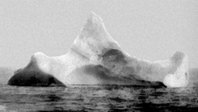 The iceberg suspected of having sunk the RMS Titanic. This iceberg was photographed by the chief steward of the liner Prinz Adalbert on the morning of April 15, 1912, just a few miles south of where the “Titanic” went down. The steward hadn\'t yet heard about the Titanic. What caught his attention was the smear of red paint along the base of the berg, indication that it had collided with a ship sometime in the previous twelve hours. This photo and information was taken from \"UNSINKABLE\" The Full Story of RMS Titanic written by Daniel Allen Butler, Stackpole Books 1998. Other accounts indicated that there were several icebergs in the vicinity where the TITANIC collided.