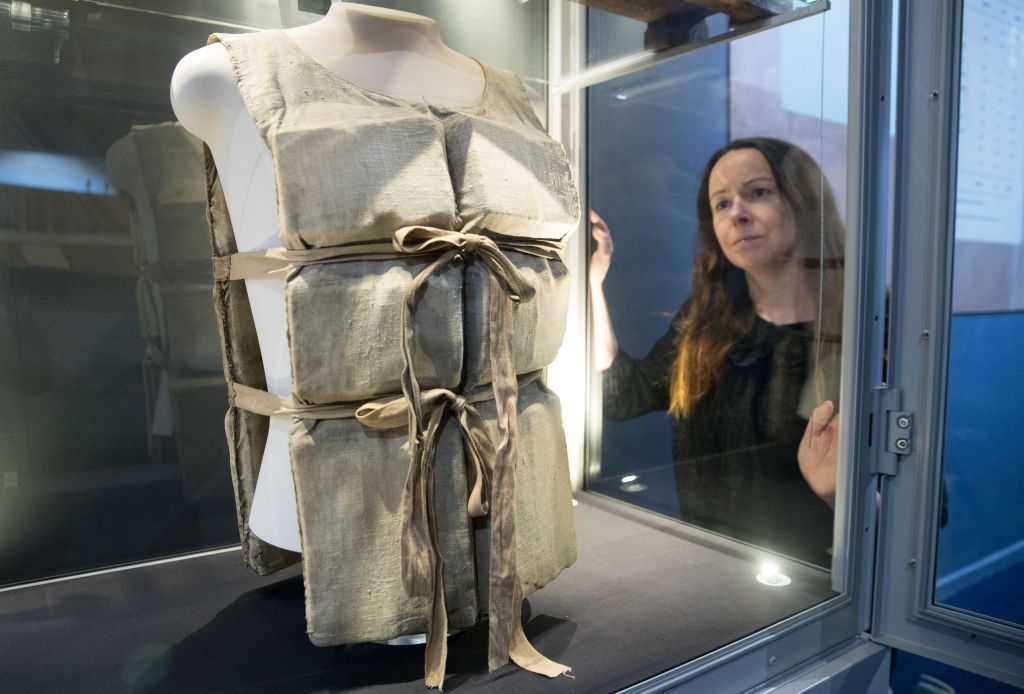 Lauren Hogan looks at lifebelt from the Titanic, one of only a couple that remains in existence, that was given by a survivor to a waiter working on the rescue ship Carpathia, and is being displayed as part of the new Titanic Stories exhibition at the National Maritime Museum Cornwall in Falmouth on March 6, 2018, in Cornwall, England.