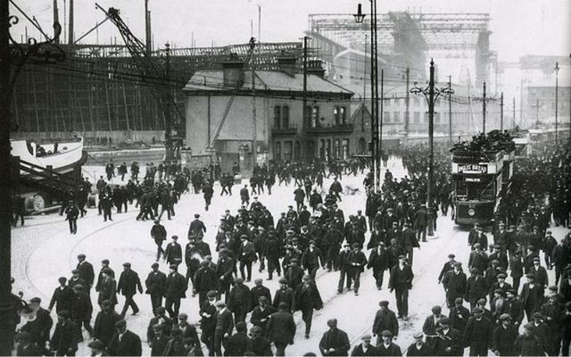 An image of knocking off time at Harland & Wolff, Belfast. The ship in the background is the Titanic.