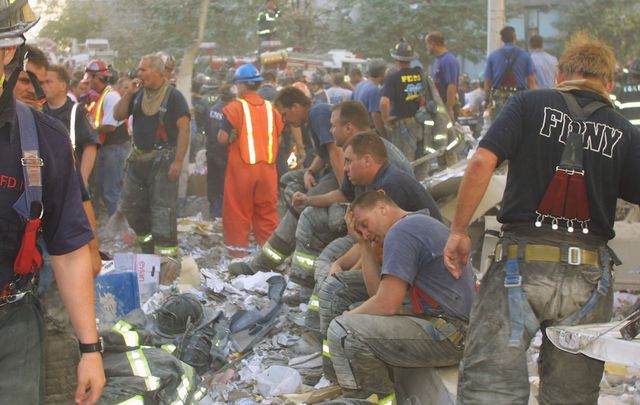 Exhausted 9/11 first responders at Ground Zero on Sept 11 2001, at the World Trade Center.