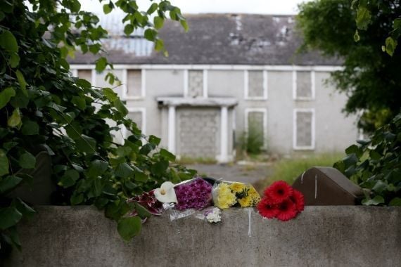 Flowers outside the abandoned farm where Ana Kriegel's body was discovered.
