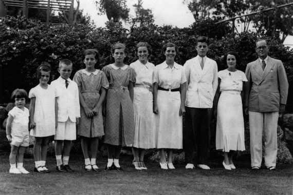 1937: Joseph Patrick Kennedy (right), his wife Rose Kennedy (second from right) and eight of their nine children, from left: Edward, Jeanne, Robert, Patricia, Eunice, Kathleen, Rosemary and John F Kennedy (Getty Images)