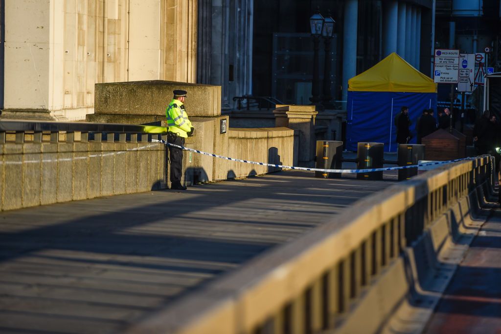 A Police officer stands next to where Usman Khan was shot, on London Bridge, on December 2, 2019 in London, England. (Photo by Peter Summers/Getty Images)