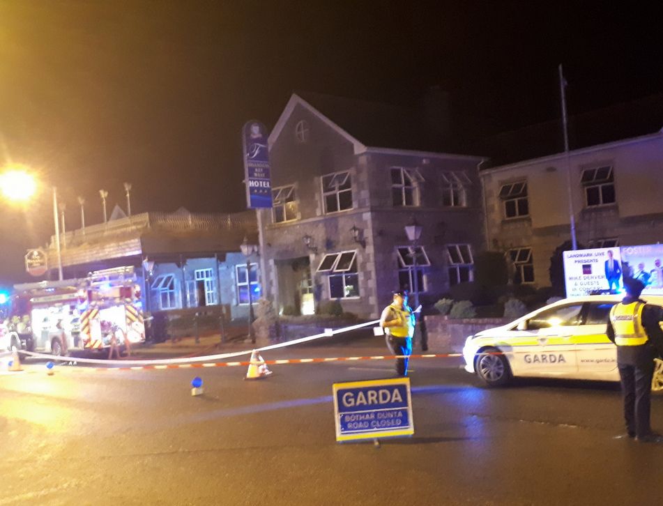Police attending a fire at the Rooskey hotel designated for Direct Provision.