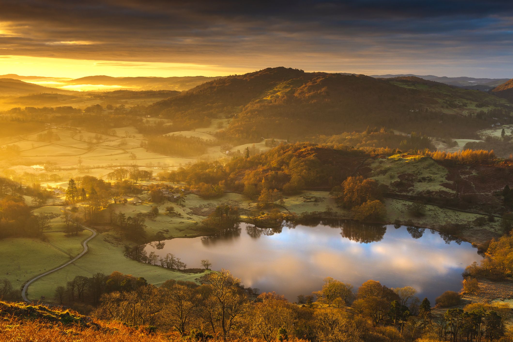 A stunning sunrise over the old Loughrigg Tarn at the heart of the English Lake District National park, Cumbria, UK. Image: Getty. 