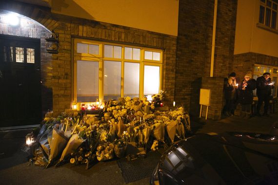 Flowers and mementos left outside the McGinley family house.