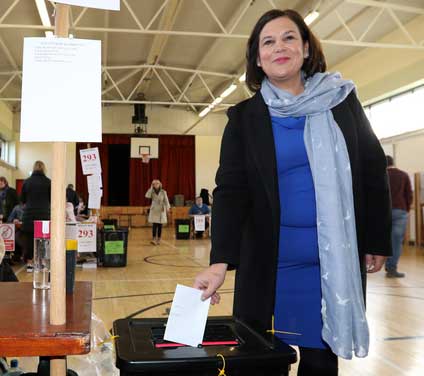Sinn Fein President Mary Lou McDonald casts her vote into the ballot box at the polling station at St. Joseph's School for Deaf Boys, Navan Road, Cabra Dublin. Credit: RollingNews.ie