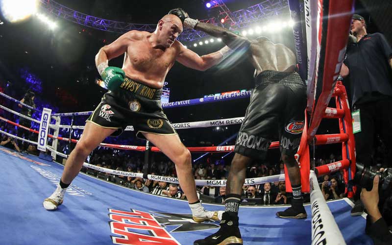 Tyson Fury punches Deontay Wilder during their Heavyweight bout for Wilder's WBC and Fury's lineal heavyweight title on February 22, 2020 at MGM Grand Garden Arena in Las Vegas, Nevada. Credit: Al Bello/Getty Images