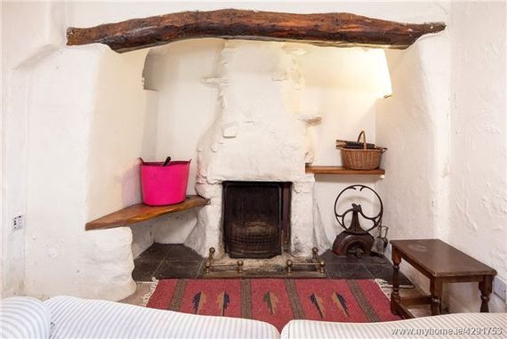 An open fire! Inside the Ballycotton thatched cottage.