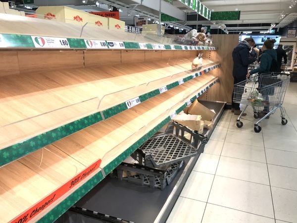 Bread is cleared out of a supermarket amid Coronavirus panic buying - Rolling News