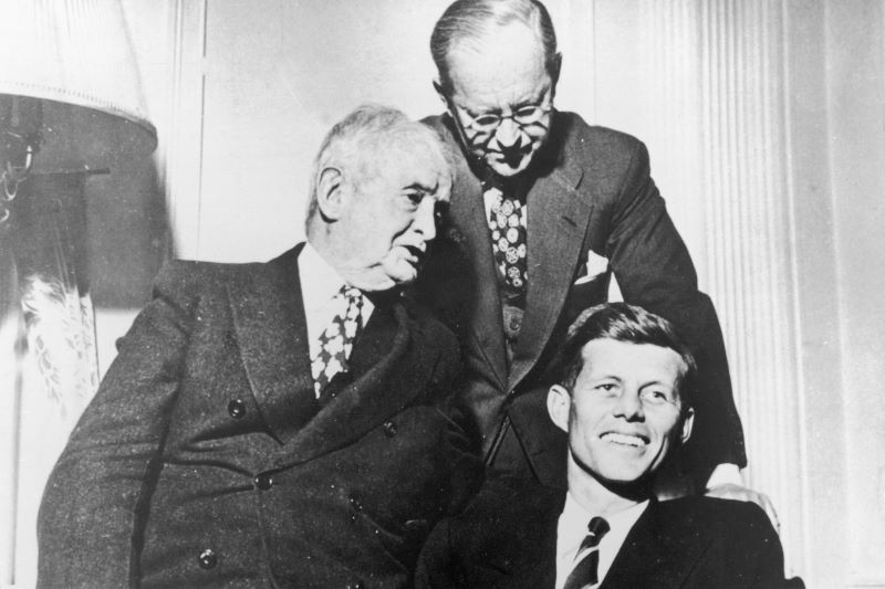 John F. Kennedy sitting with John F. Fitzgerald, and Joe Kennedy Sr. (Getty Images)