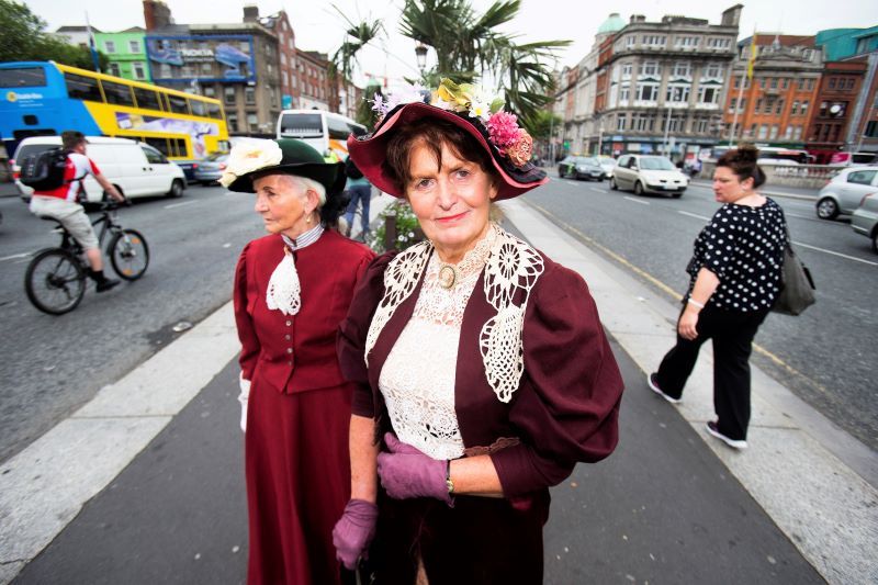 June 16, 2015: Eileen Fennell and Maragaret Toomey from Glasnevin pictured on O Connell Street Bridge Dublin waiting for a lift from a friend to Dalkey as they took part in the Bloomsday celebrations around Dublin. (RollingNews.ie)