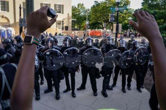 Military Police confront protestors outside The White House. Military Police confront protestors outside The White House.