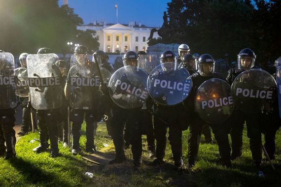 Military Police confront protestors outside The White House. Military Police confront protestors outside The White House.
