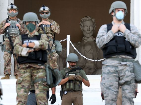 Masked military police assemble at the Lincoln Memorial in Washington DC Masked military police assemble at the Lincoln Memorial in Washington DC. Credit: Getty